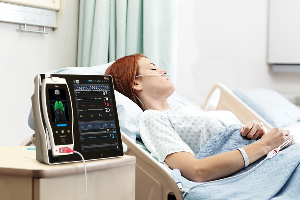 patient lying in hospital bed with a cannula